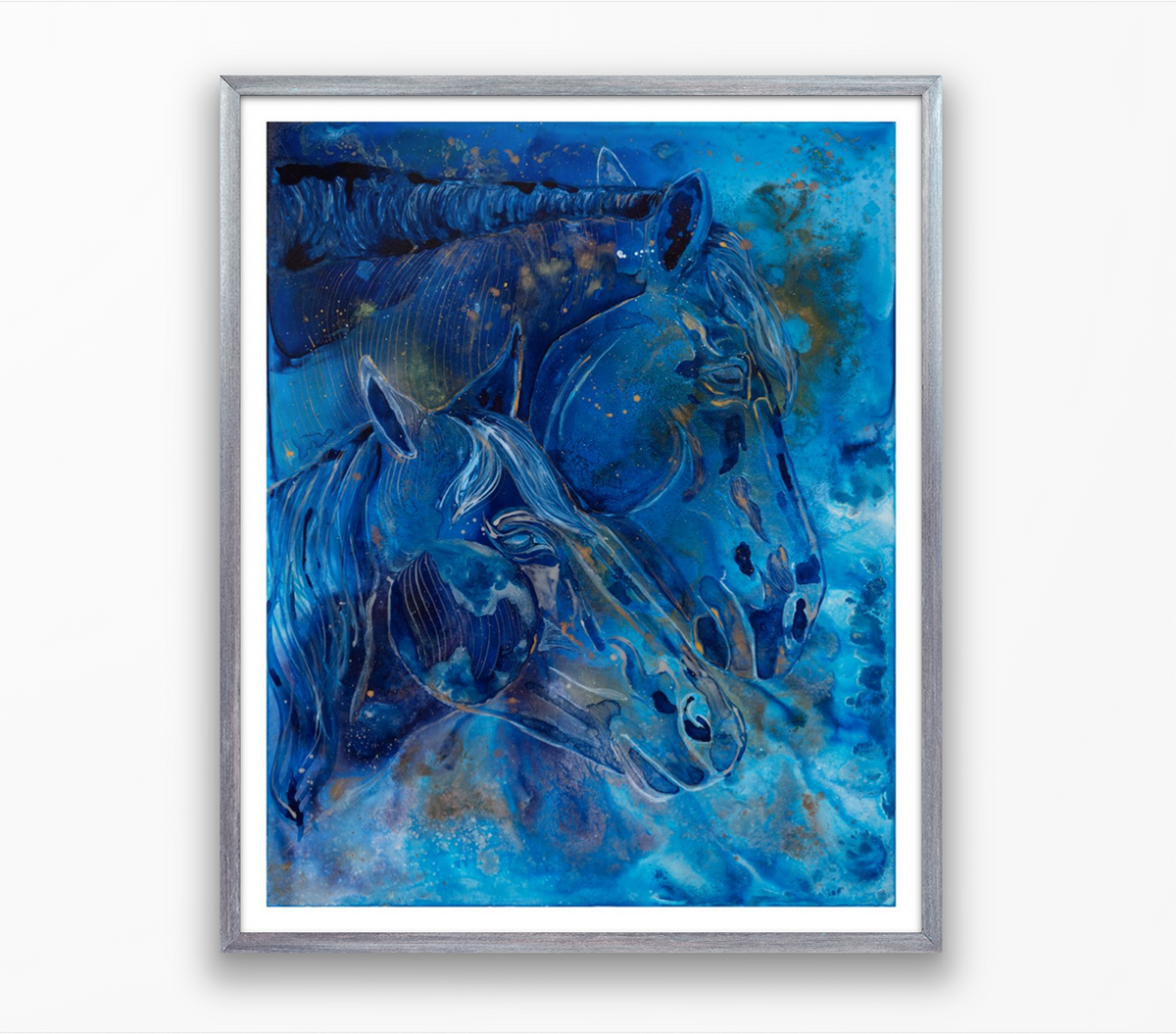 Framed artwork of two blue horses on a white background