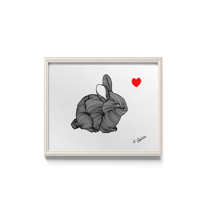 Framed artwork of a bunny with a red heart on a white background