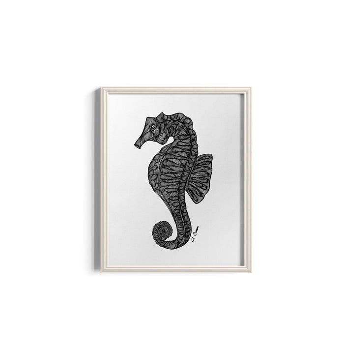 Framed artwork of a black seahorse on a white background