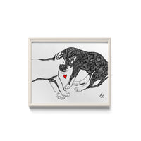 Framed black and white illustration of two puppies sleeping with a red heart.