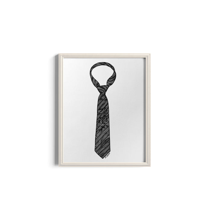 Framed artwork of a black and white striped tie on a white background